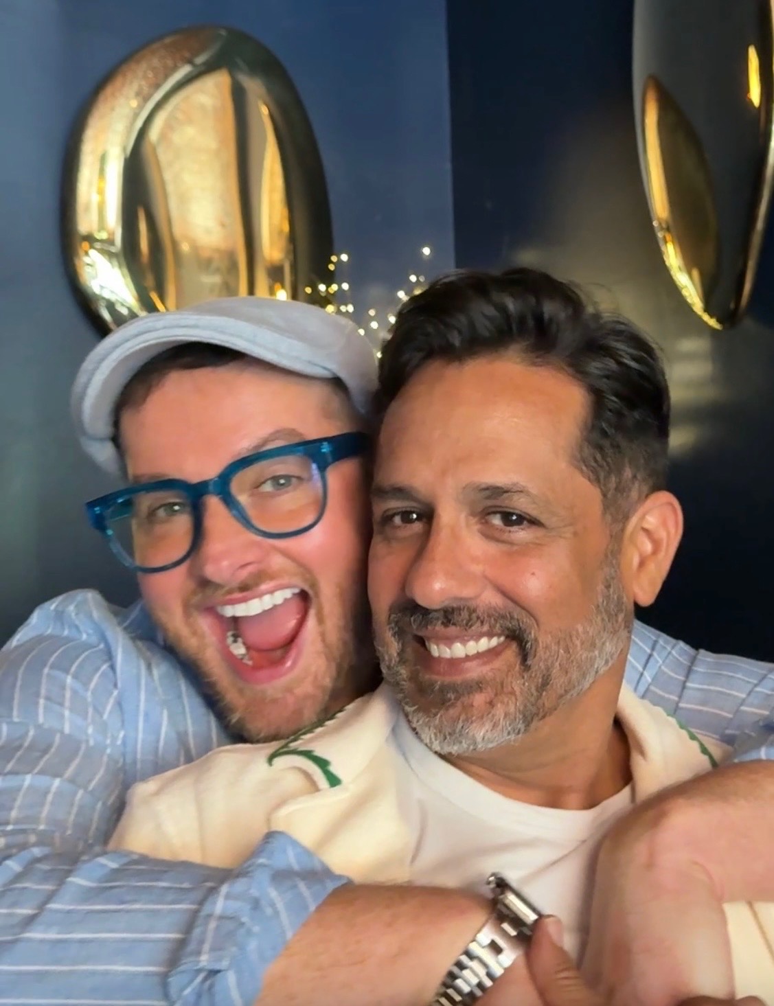 Wil Mcerlean and Charlie Bonanno, owners of Wil's Martini Lounge, embracing at the lounge