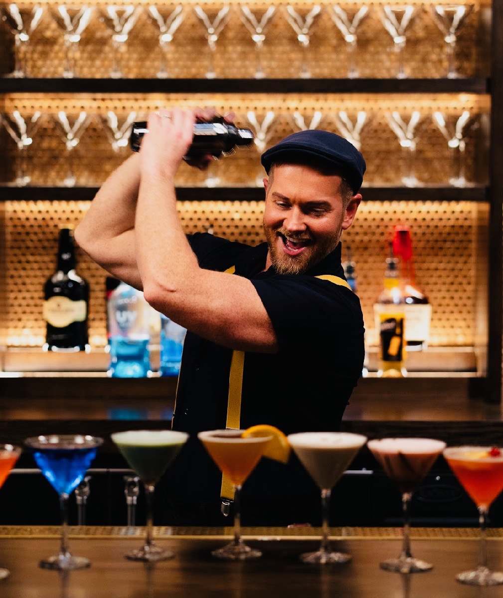 Shaking martinis behind the bar at Wil's